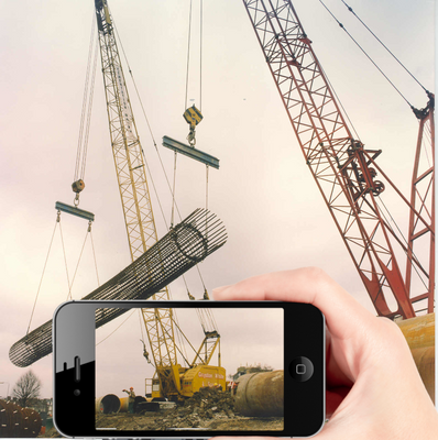load_carrying_crane-two-cranes-with-mobile-device.png